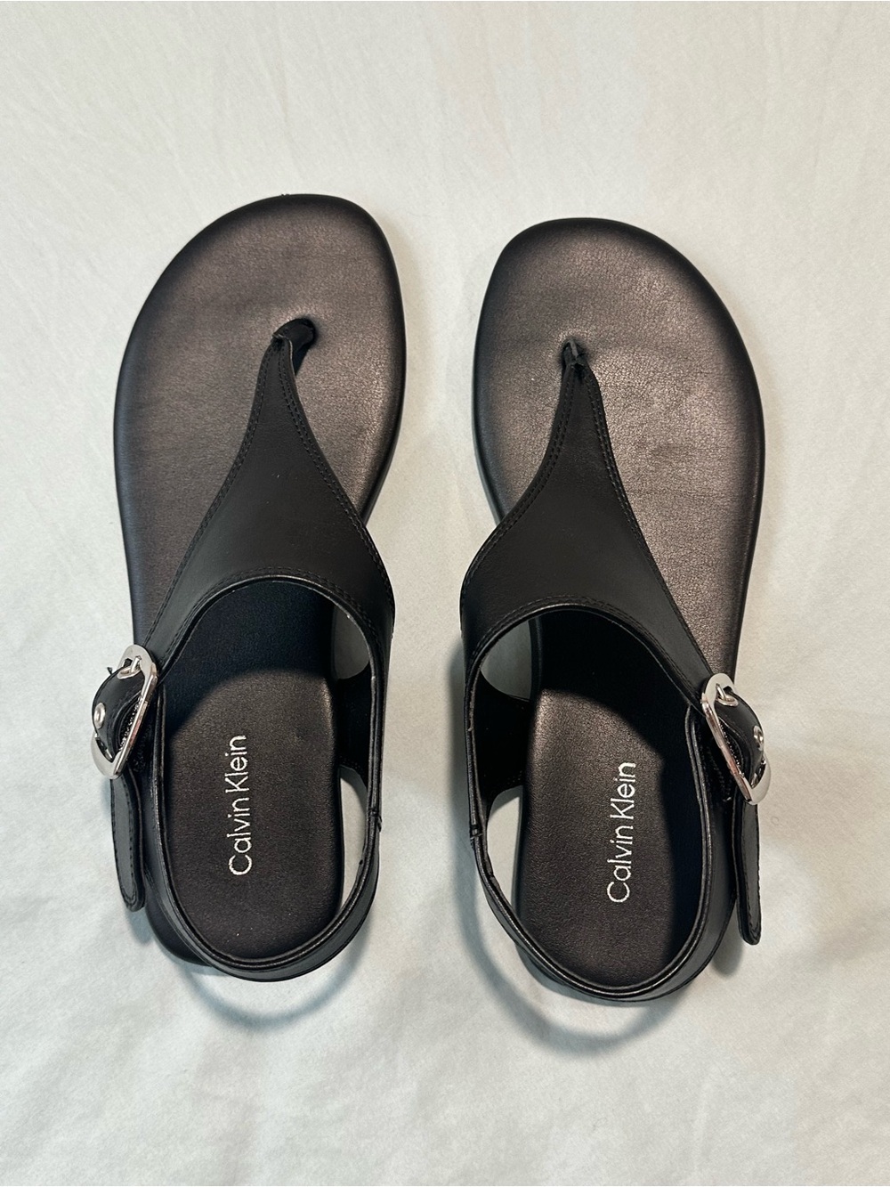 Calvin Klein Black Thong Sandals with Silver Buckle Accent